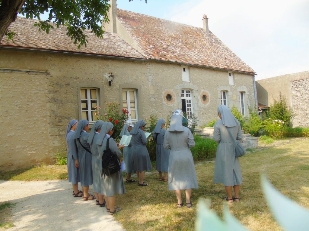 Praying in front of the presbyter of Fr. Louis Chauvet