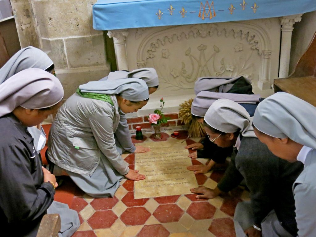 Praying at the tomb of Mother Marie Anne de Tilly